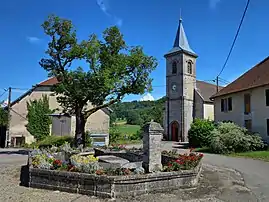 The church and water trough in Vaudrivillers