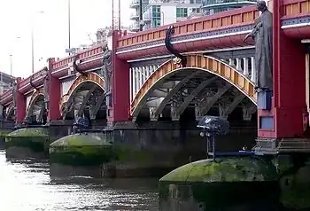 Image 12Vauxhall Bridge across the River Thames opened in 1906 and features sculptures by F. W. Pomeroy.