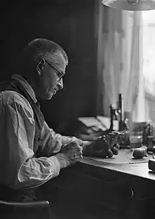 Veli Räsänen working at desk