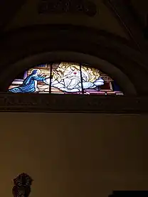 Grass window in the church representing the love of Jesus in the right side of the Church of St. Peter and Paul, Arese