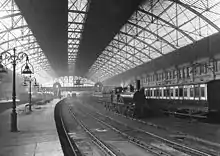 The station in 1885. Note the signal box on the passenger footbridge which controlled movements in station.