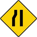 Road narrows on left side