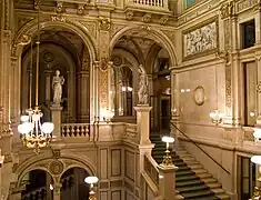 A marble staircase between the main entrance and the first floor