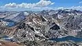 Epidote Peak is black feature in lower left. View from Dunderberg Peak looking west. Summit Lake to left, Hoover Lakes lower left, East Lake lower right. Camiaca Peak (reddish) left of center, Gabbro Peak lower right, Twin Peaks upper right.