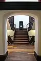 View of stairs through an archway