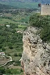 The 10 m observation deck of Ronda, Spain, overlooks the Depression of Ronda plain over 100 m below.