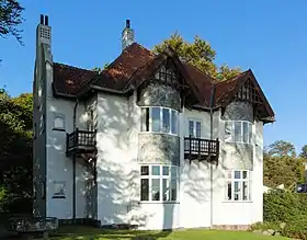 Building with central cupola and wings with Greek-style columns