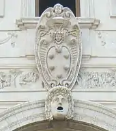 The Medici coat of arms with five balls, above Loggia dei leoni