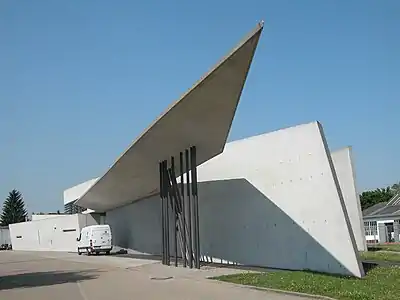 Sharply angled planar surfaces are reminiscent of a bird in flight.