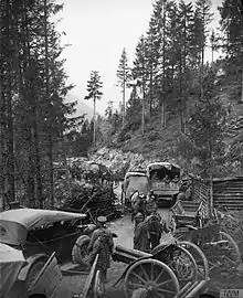 Italian and British troops passing abandoned Austro-Hungarian artillery on the Val d'Assa mountain road, 2 November 1918