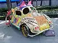 An Alebrije (Mexican artcraft) in the shape of a Volkswagen Beetle