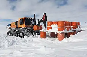 Woman working at the West Antarctic Ice Sheet (WAIS) Divide Field Camp in 2012.