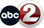 A logo with two different circular elements; the black ABC logo introduced in 2021, then the station's main numerical logo, which features a numerical gray-gradient "2" inset into a thick circle of the same color. A contrasting dark red gradient fills in the space between the circle and the "2"