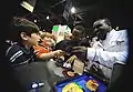 WCAP athletes sign autographs for fans, 2009 AUSA Conference.