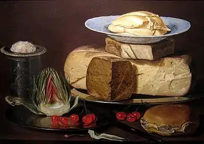 Still life with the same porcelain dish, now placed under the butter curls