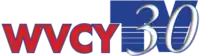 In red, the station's call letters, "WVCY", are rendered in red with black edging. Next to it, a stylized thick blue logo reading "TV" appears with several lines in the bottom portion. WIthin the TV logo, a white and italicized serifed "30" appears.