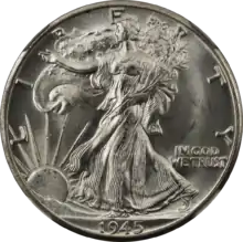 A 50-cent American silver coin dated 1945 and showing Lady Liberty walking, draped in the American flag