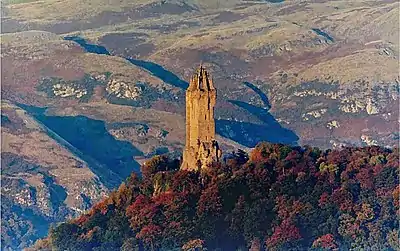 Image 14The Wallace Monument is a sandstone tower, built in the Victorian Gothic style. It stands on the summit of Abbey Craig,  a volcanic crag above Cambuskenneth Abbey, from which Wallace was said to have watched the gathering of the army of English king Edward I, just before the Battle of Stirling Bridge.Photo credit: Ray Mann