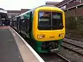 A Class 323 in its former London Midland livery at Walsall