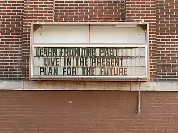 Entrance sign before demolition