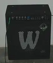 A combination bass amplifier/speaker cabinet with both a loudspeaker and a tweeter. The tweeter is mounted in a horn.