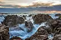 Image 8Waves on rocks at sunset in Sète, France