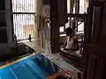 Weaver in a silk-weaving workshop; Varanasi, Uttar Pradesh, India