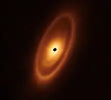 Image 45Astronomers used the James Webb Space Telescope to image the warm dust around a nearby young star, Fomalhaut, in order to study the first asteroid belt ever seen outside of the Solar System in infrared light. (from Cosmic dust)