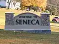 Sign welcoming people to Seneca, on MO 43.