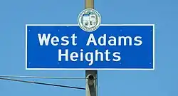 West Adams Heights neighborhood sign located at the intersection of Western Avenue and the Santa Monica Freeway