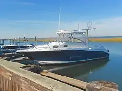 Boat docked behind a house