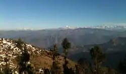 A view of the left half of the Gangotri Group in the Western Himalayas from Pauri, part of which is seen on the left.
Pauri City as viewed from adjacent hill.