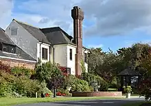 Western House, Ayr.  An Arts and Crafts house designed and built by architect Harold Ogle Tarbolton (1919-25) for David Shaw, racecourse manager, and the Western Club. Owned by Ayr racecourse and operates as a hotel.  Listed building LB47172.