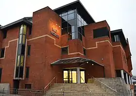 The building which Media Molecule's headquarters resides. About five floors high with a mostly brick structure and some glass panels.