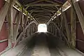 The inside of the bridge showing the Burr arch truss design