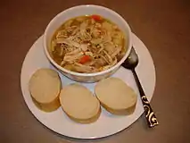 Chicken noodle soup, with bread