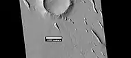 Yardangs near a crater, as seen by HiRISE under HiWish program Location is in the Amazonis quadrangle.