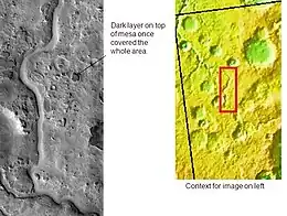 Auqakuh Vallis. At one time a dark layer covered the whole area, now only a few pieces remain as buttes. Image was taken with THEMIS.