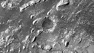 Crommelin crater showing layers in buttes and inside a small crater, as seen by CTX camera.  Note: this is an enlargement of a previous image.