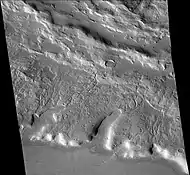 Channels just to south of Sinton Crater, as seen by CTX camera (on Mars Reconnaissance Orbiter). These were created when the impact occurred in ice-rich ground.  Note: this is an enlargement of the previous image of west side of Sinton.