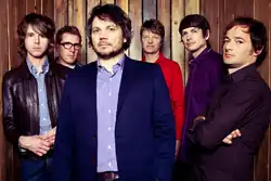 Wilco at Massachusetts Museum of Contemporary Art, Solid Sound Fest, 2011. Pictured left to right: Patrick Sansone, Mikael Jorgensen, Jeff Tweedy, Nels Cline, Glenn Kotche, John Stirratt