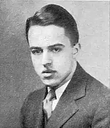 Photo portrait of a young man in a suit with a combed-back hairstyle