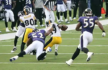 Ray Lewis (52) and Terrell Suggs (55) of the Ravens chase down Steelers Willie Parker, 2006.