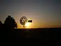 American wind mill during sunset