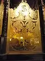 Etched window glass with "SS" motif