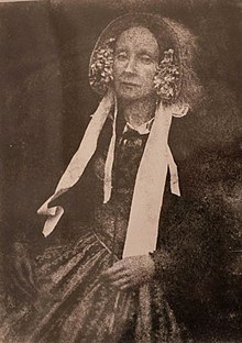 black and white photograph of a woman wearing a bonnet who is thought to be Jessie Mann