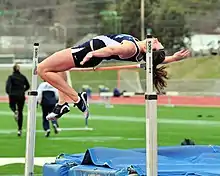 Image 23A woman attempting to high jump whilst using the Fosbury Flop technique (from Track and field)