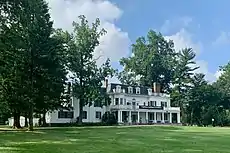 Facing the great lawn, with an Eagleton Institute of Politics banner
