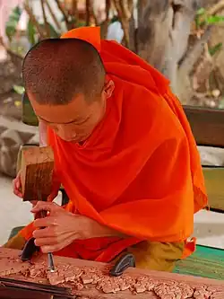 Image 33Lao monk woodworking temple details (from Culture of Laos)