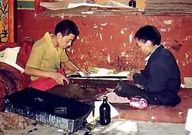 Young monks printing scriptures. Sera Monastery, 1993